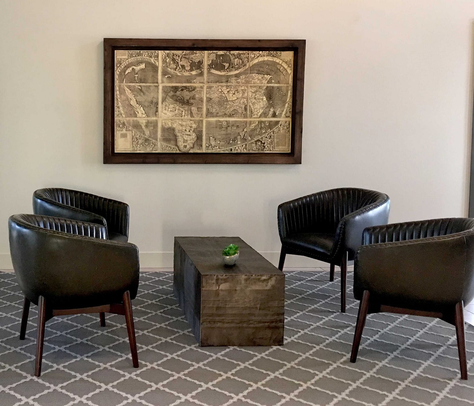 seating area in winter color season palette with black leather chairs