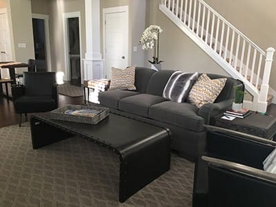 custom sofa in gray fabric with black coffee table