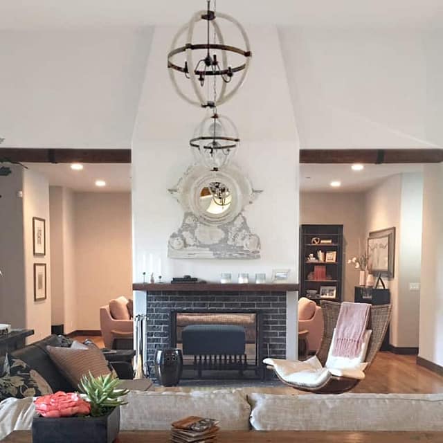 electic living room with fireplace and wrought-iron chandelier